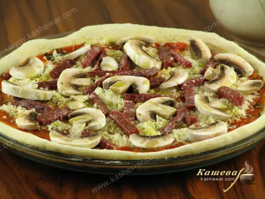 Pizza with sausage and mushrooms
