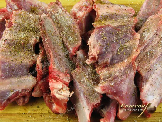 Grate lamb ribs with spices