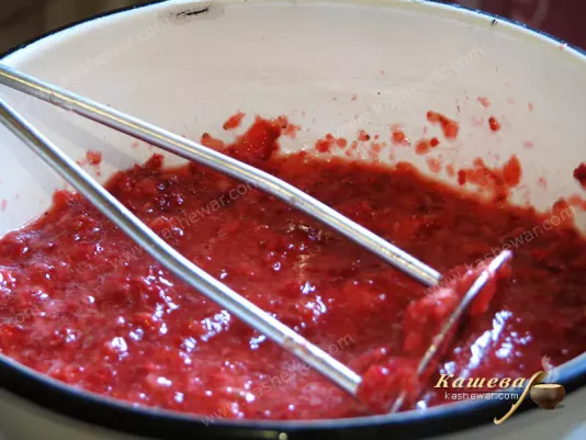 Chopping strawberries for jam