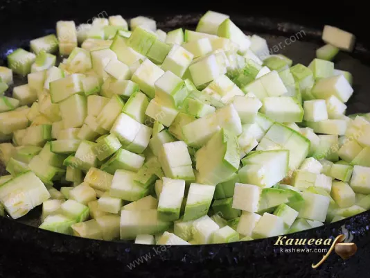 Zucchini, diced in a frying pan