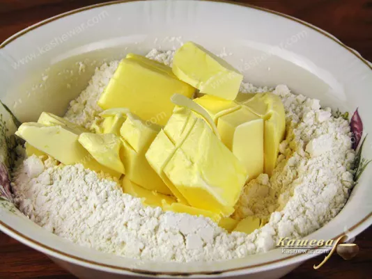 Grind butter with flour into crumbs