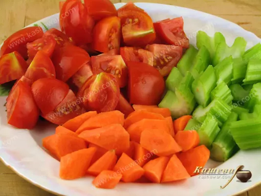 Carrots, tomatoes and stalked celery for stew