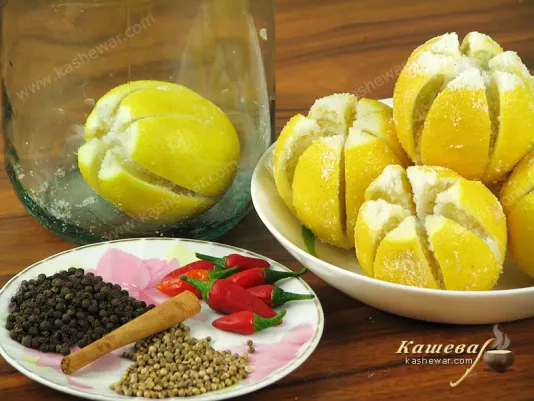 Pour salt into the cuts of the lemons and put in jars