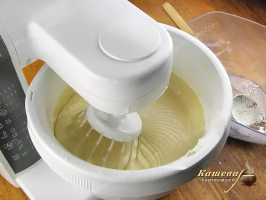 Butter, sugar and eggs are mixed with flour for waffle dough