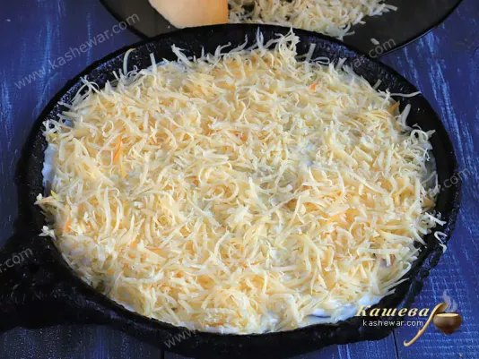 Grated cheese in a frying pan