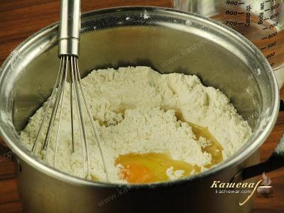 Drive eggs into the sifted flour