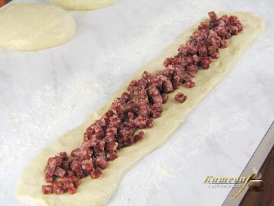 Sausage laid on the dough