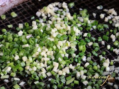 Green onions and ginger in a pan