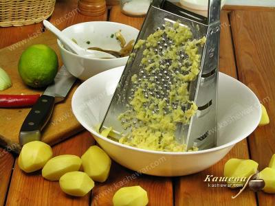 Potatoes grated on a grater with fine mesh