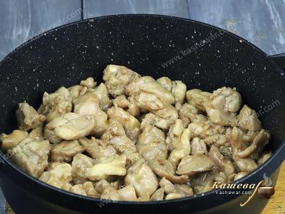 Chicken pieces in a frying pan