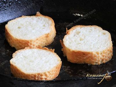 Chopped baguette in a frying pan