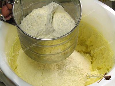 Flour is sifted into dough