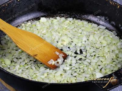 Onions fried in a pan