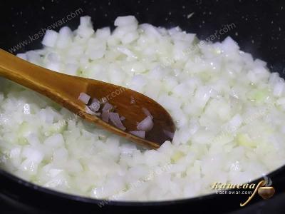 Finely chopped onion in a frying pan with oil