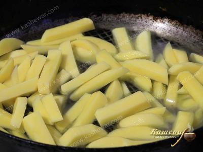 Potato sticks in a frying pan