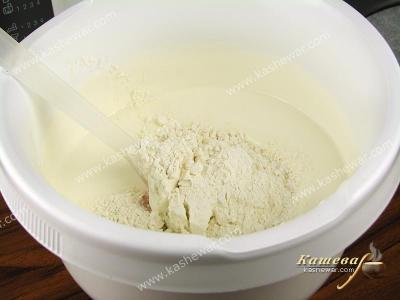 Mixing flour into biscuit dough