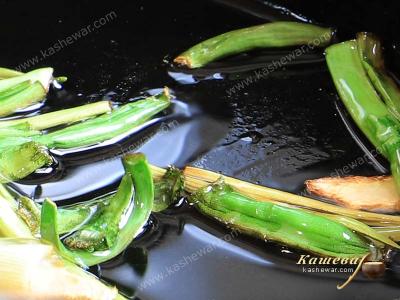 Green onions and ginger in a pan