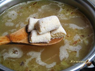 Adding semolina golush to soup