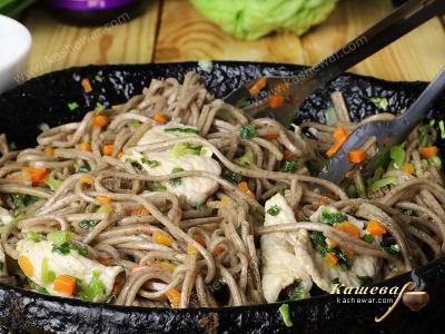 Udon noodles with pork in a pan
