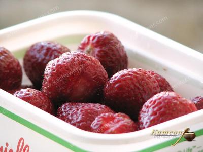 Strawberries in a freezer container
