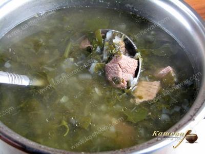 Green soup with beef